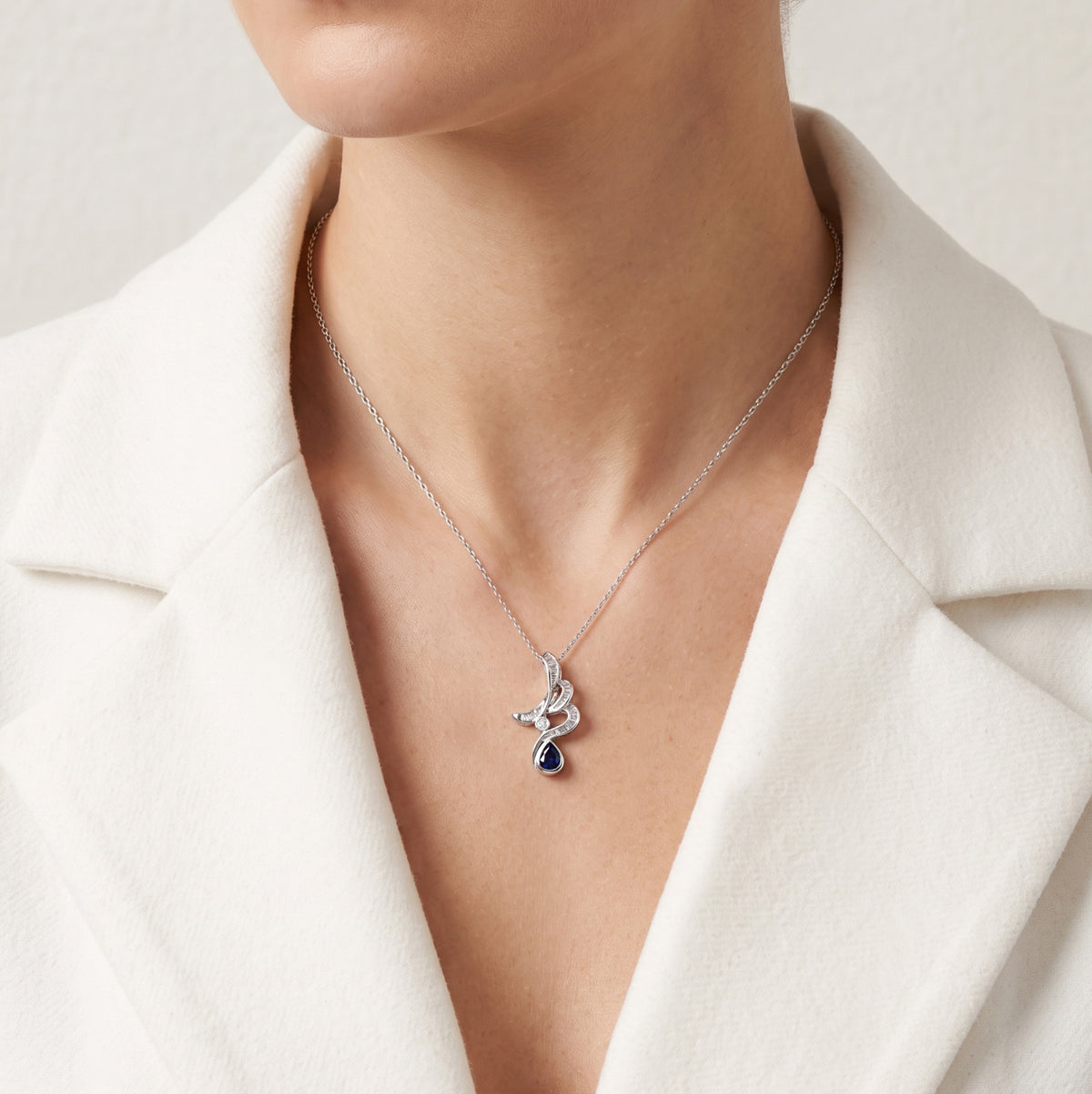 Elegant 0.40ct Blue Sapphire and 0.48ct Natural Diamond Wave Ribbon Pendant in 18K White Gold
