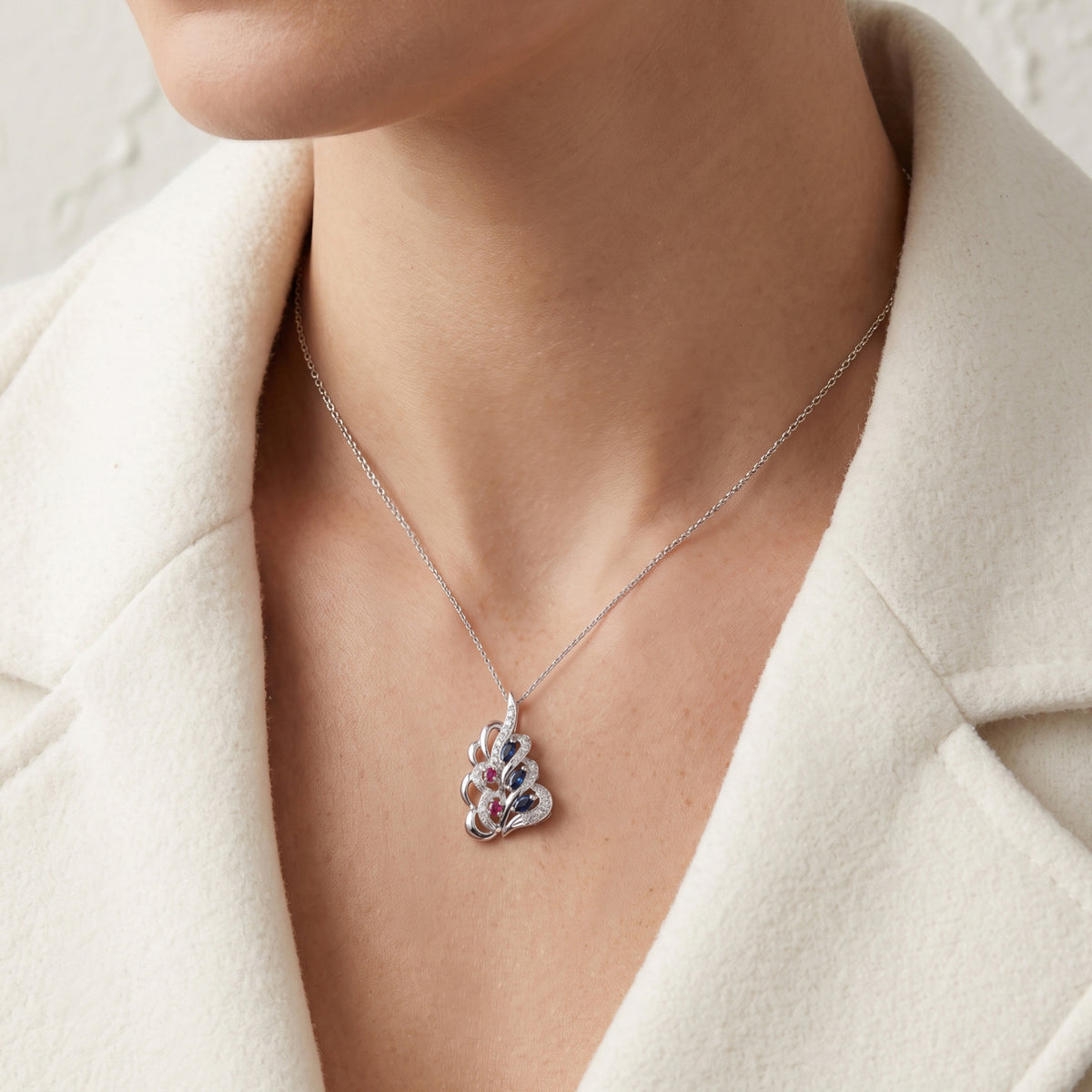 Elegant 0.30ct Blue Sapphire 0.06ct Pink Sapphire and 0.21ct Diamond Swirl Pendant in 18K White Gold