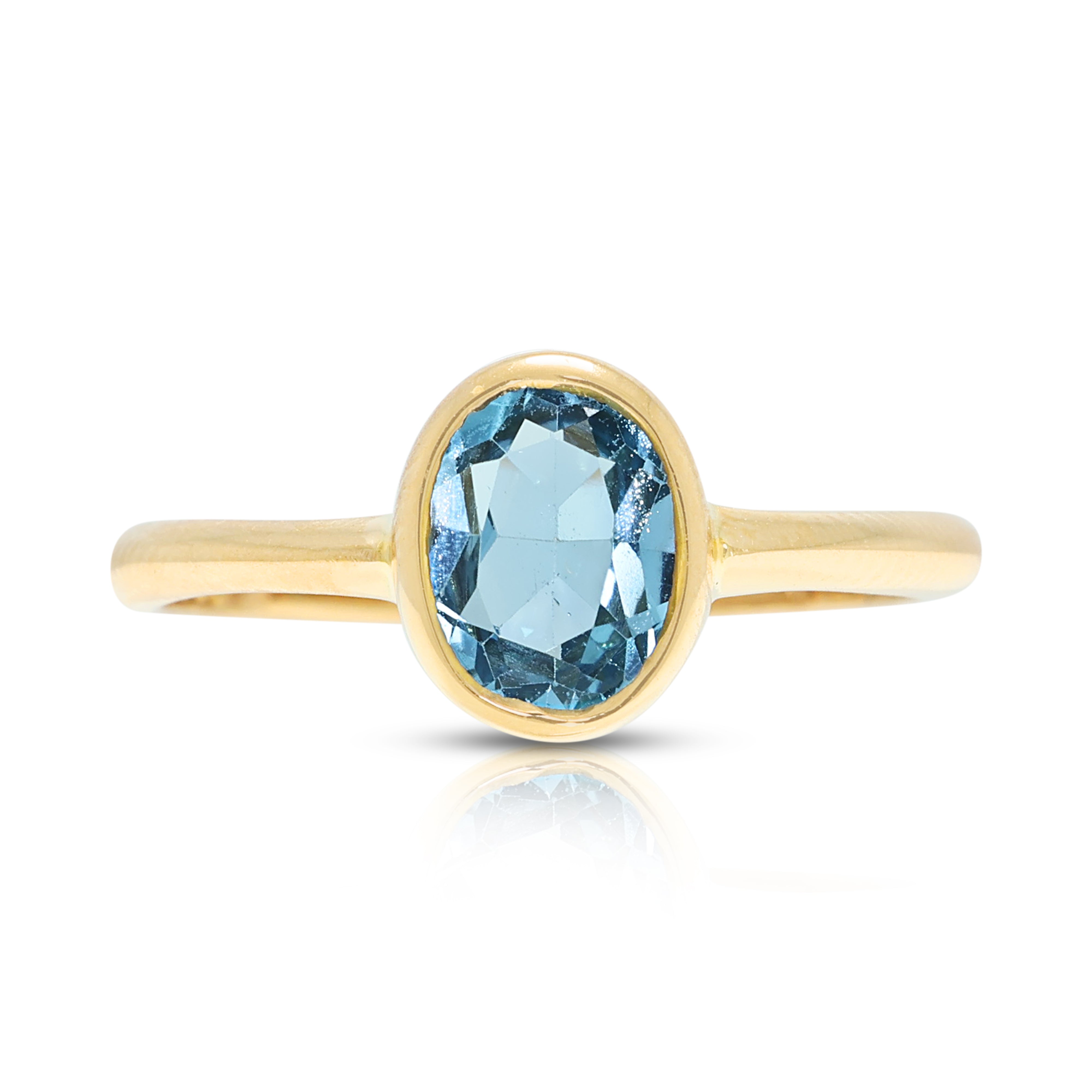 Enchanting 0.70ct Blue Topaz Solitaire Bezel Ring in 18K Yellow Gold