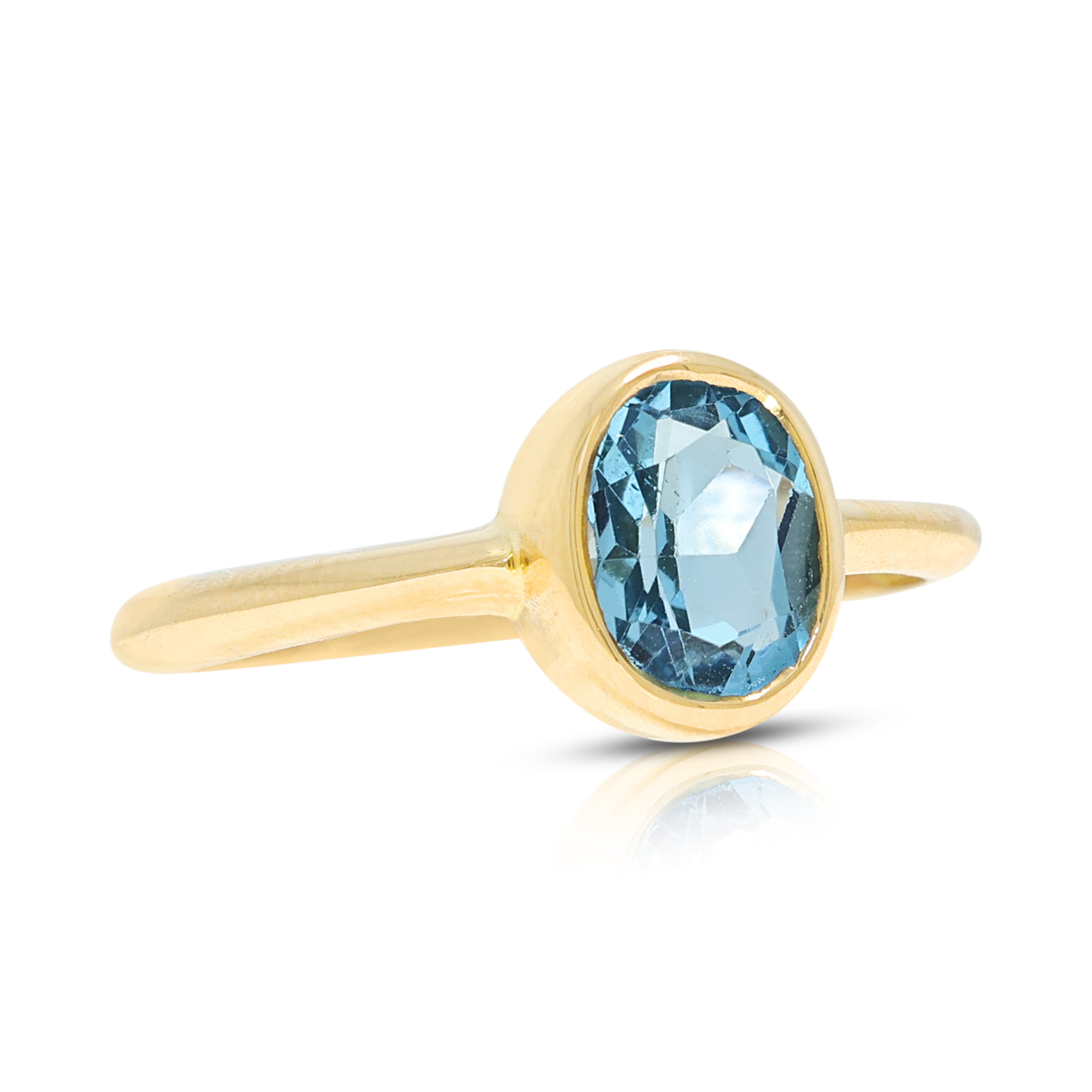 Enchanting 0.70ct Blue Topaz Solitaire Bezel Ring in 18K Yellow Gold