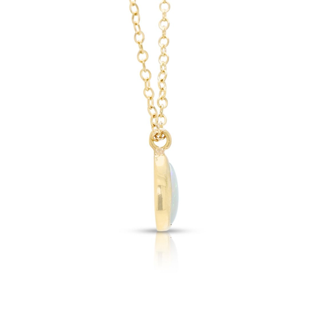 Luminous 0.50ct Opal Pendant Necklace in 14K Yellow Gold