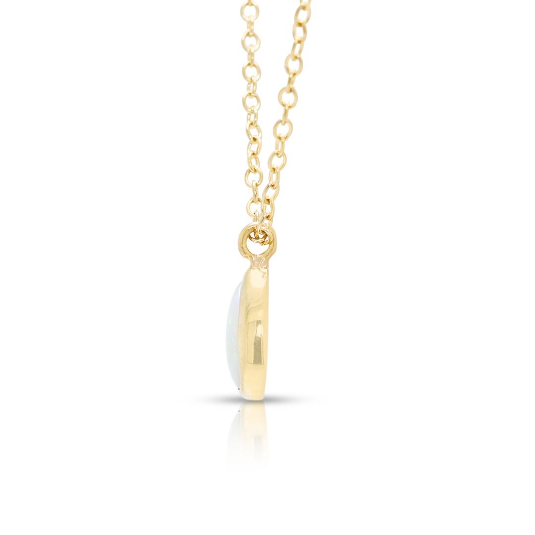 Luminous 0.50ct Opal Pendant Necklace in 14K Yellow Gold