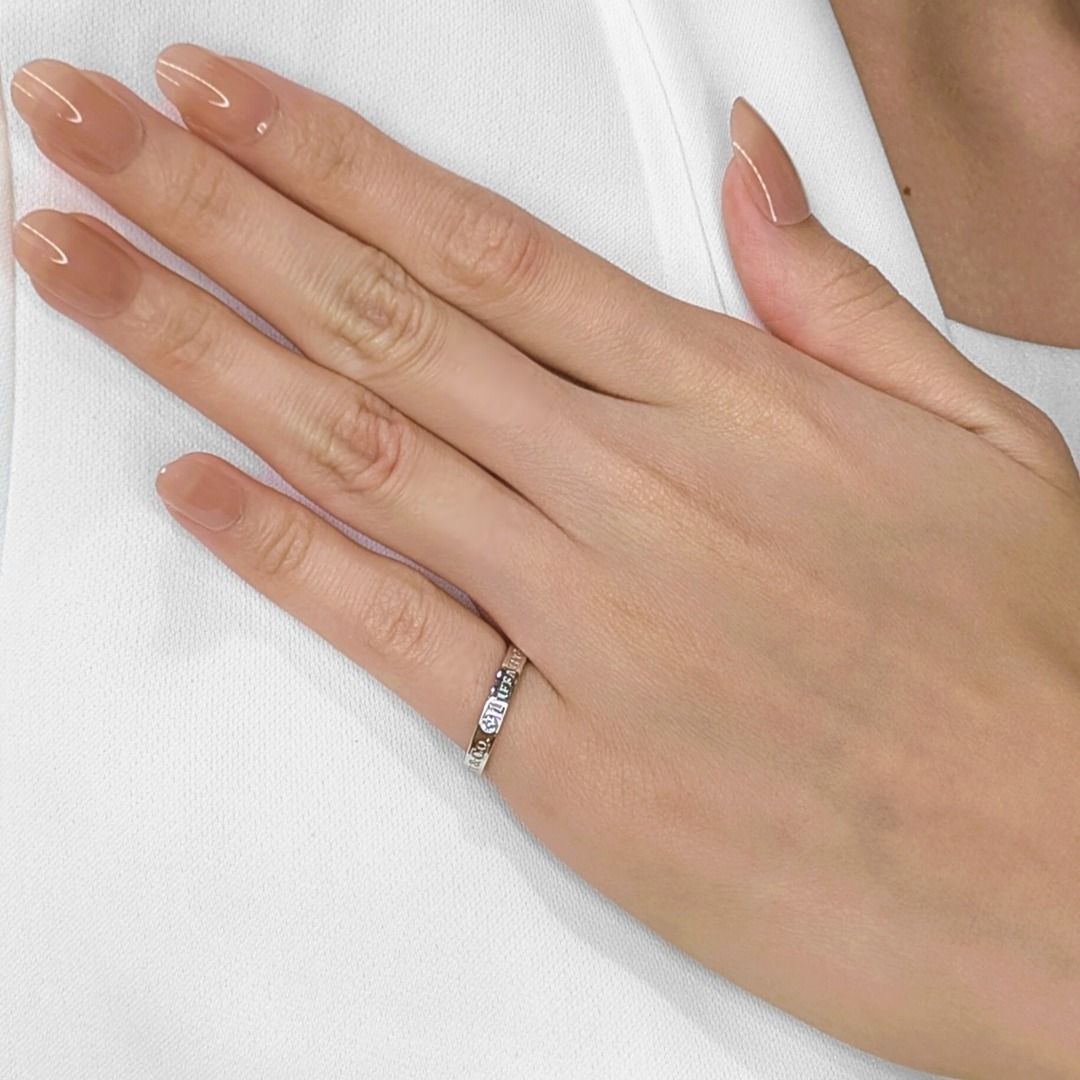 Modest 0.05ct Diamond Platinum Ring by Tiffany & Co.