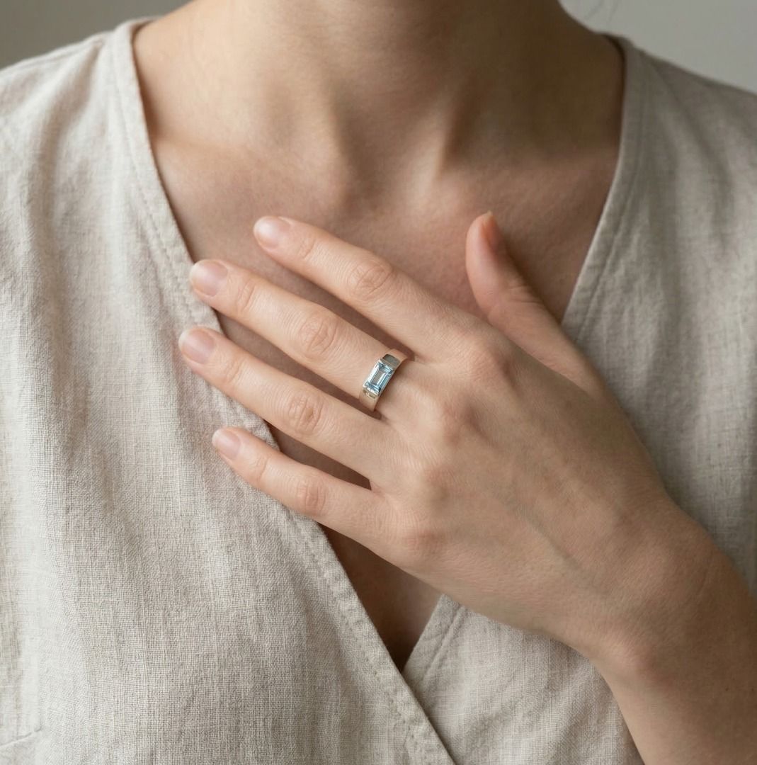 Serene 0.75ct Blue Topaz Baguette Solitaire Ring in 9K White Gold