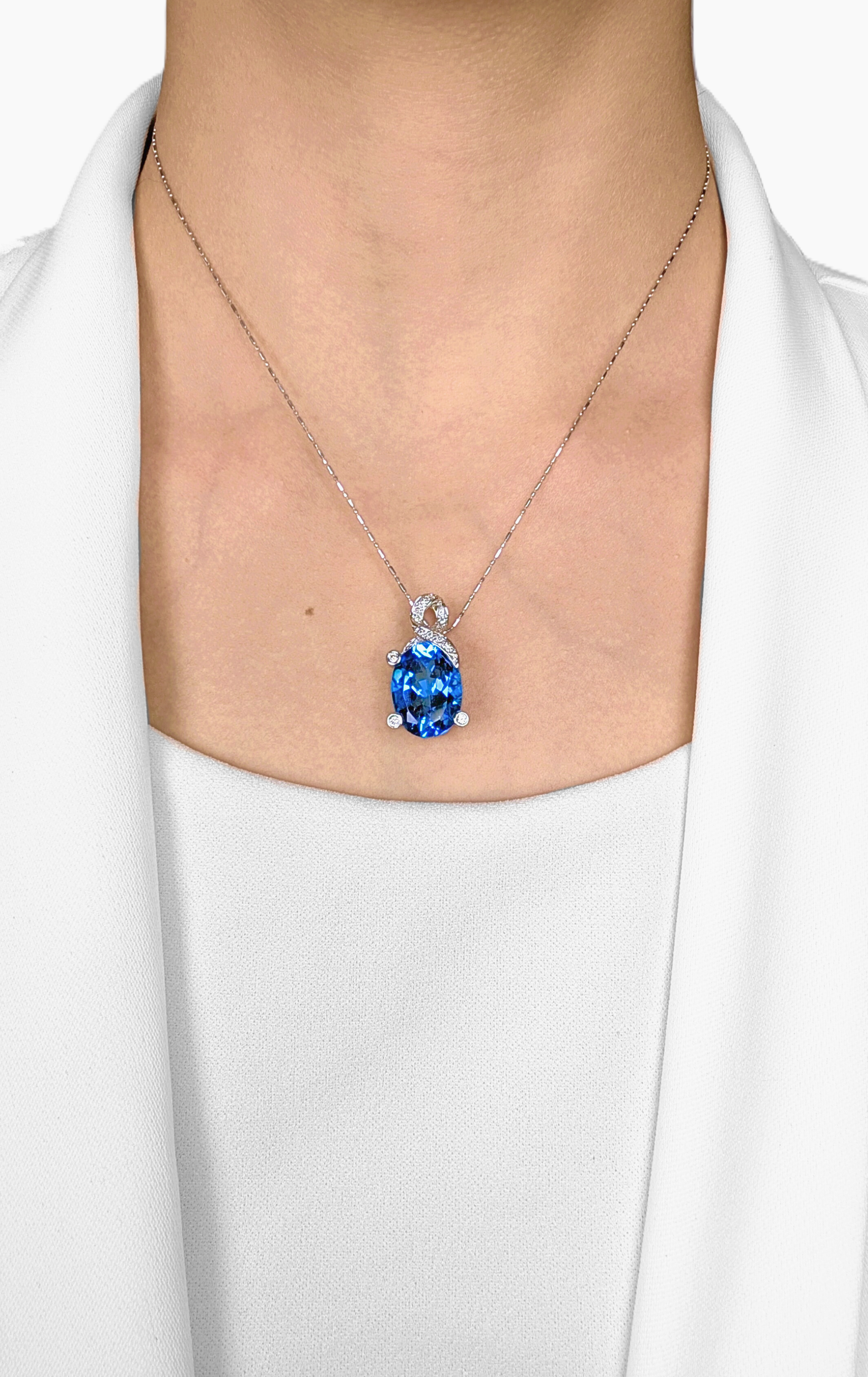 Striking 10.22ct Blue Topaz & Natural Diamond Pendant in 18K White Gold