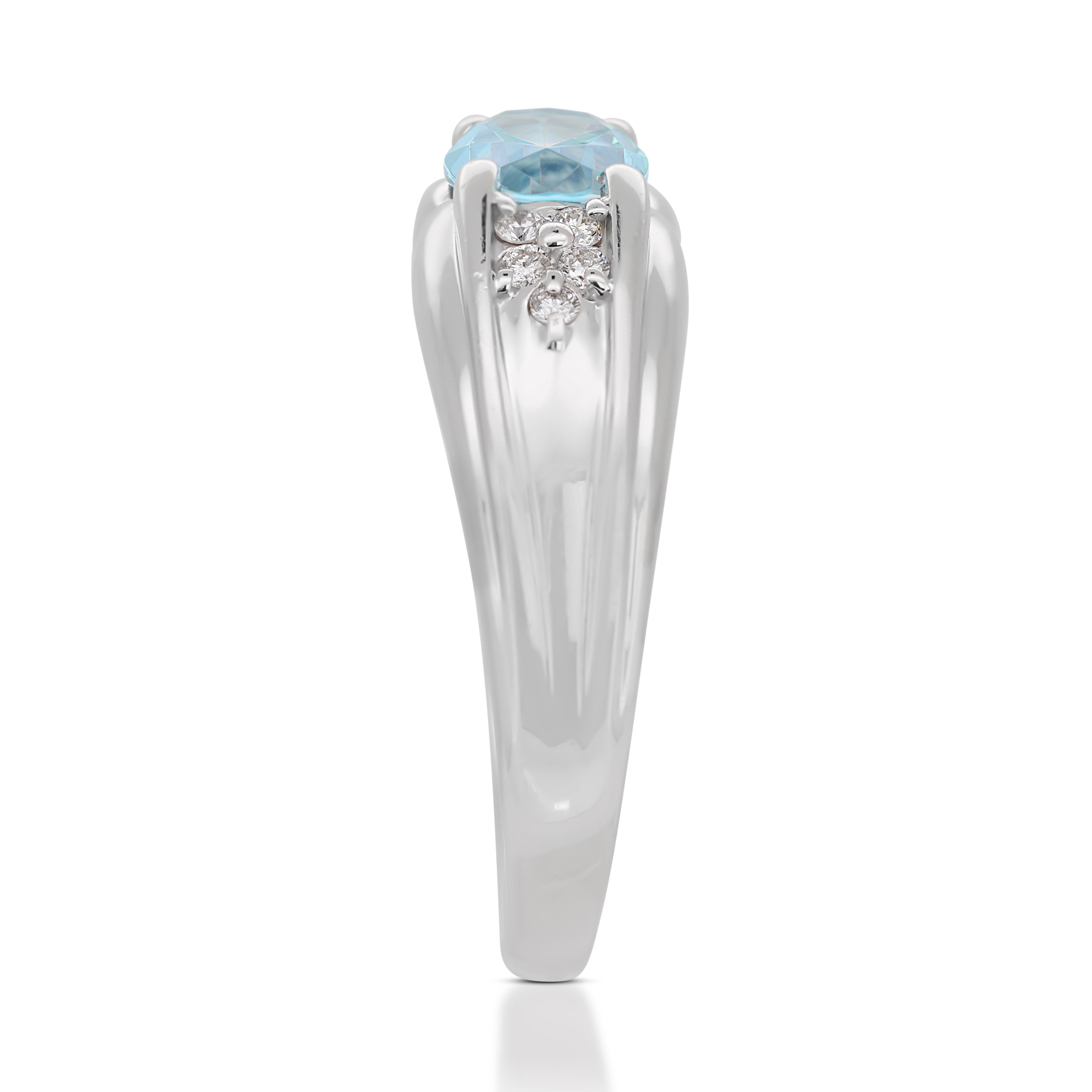 Alluring 0.96 Blue Topaz Ring with Side Diamonds in 18K White Gold