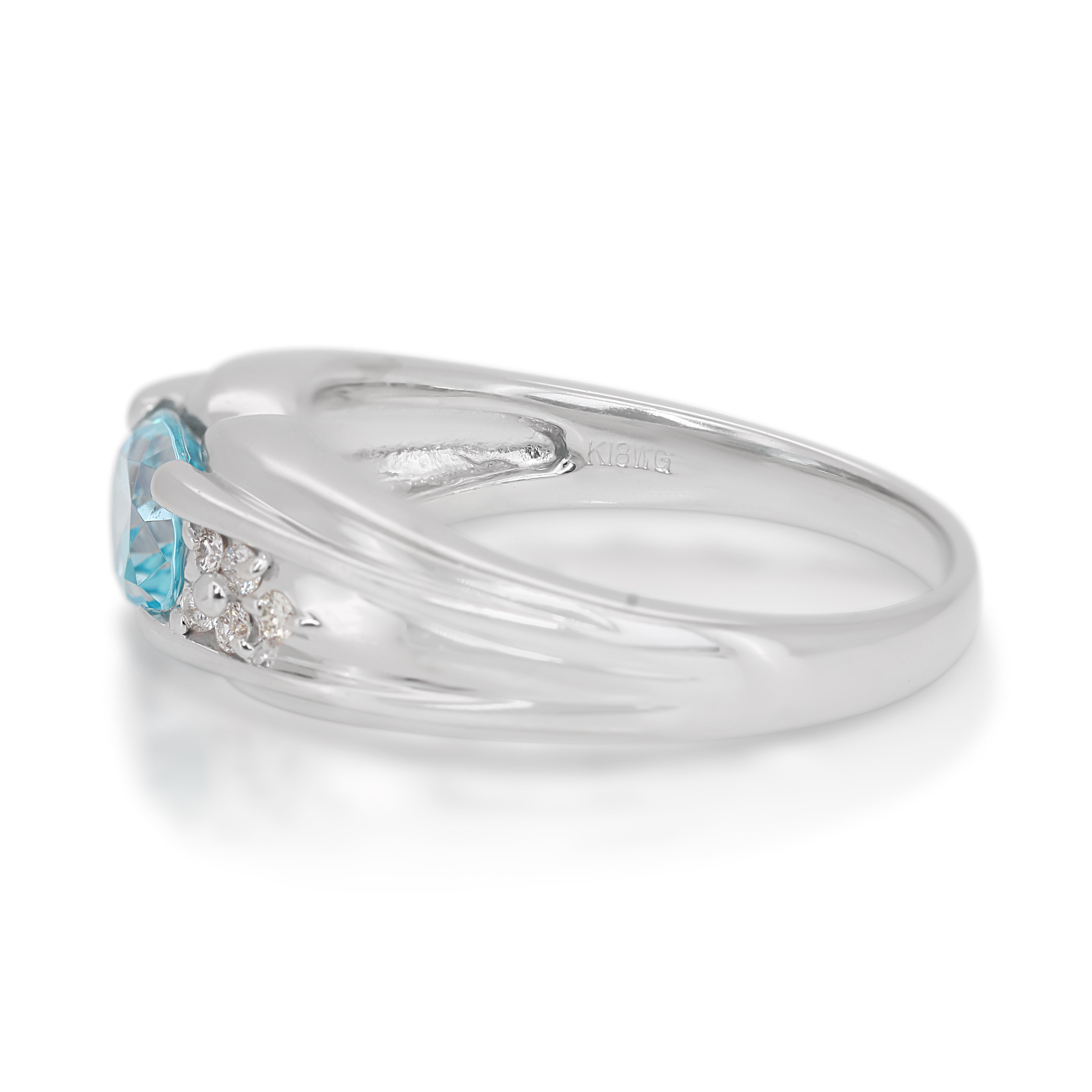 Alluring 0.96 Blue Topaz Ring with Side Diamonds in 18K White Gold