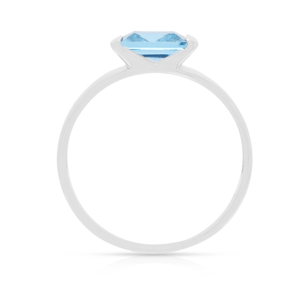 Serene 0.75ct Blue Topaz Baguette Solitaire Ring in 9K White Gold